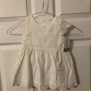 Carter’s white eyelet dress with bloomers. Size 9 months. Brand new!